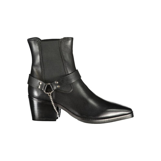 Cafenoir black leather women's ankle boot with a pointed toe, block heel, and decorative silver chain harness detail.