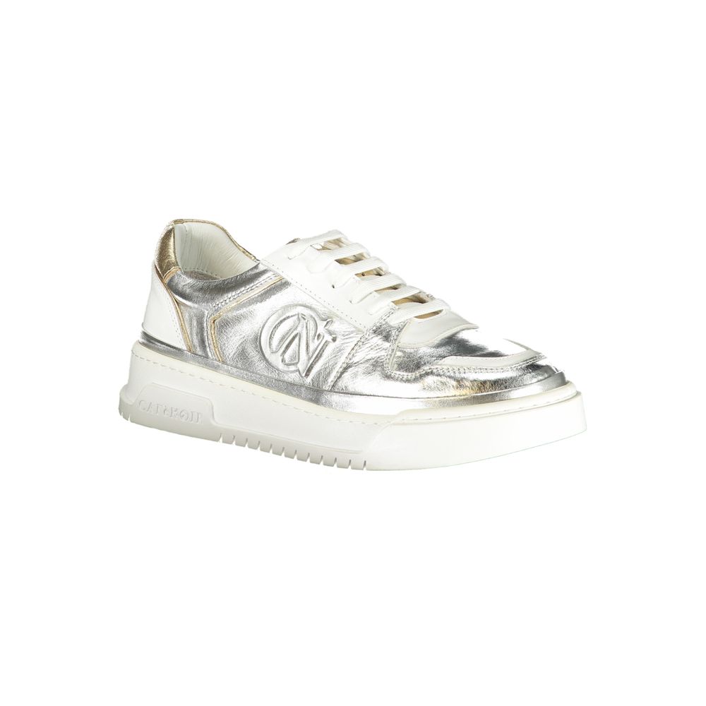Female model wearing Cafenoir silver and gold metallic crinkled leather lace-up sneakers with an embossed CN logo, gold heel counter, white laces, and white chunky platform sole, captured mid-step in a casual lifestyle pose showcasing the shoe's glamorous metallic profile and luxe detailing.