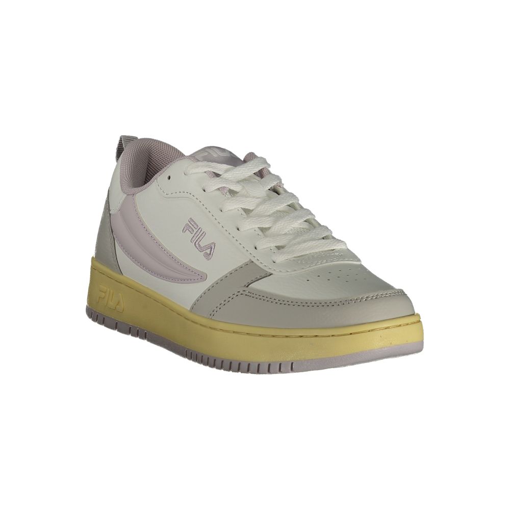 Fila sneaker with a light gray upper and yellow sole on a white background