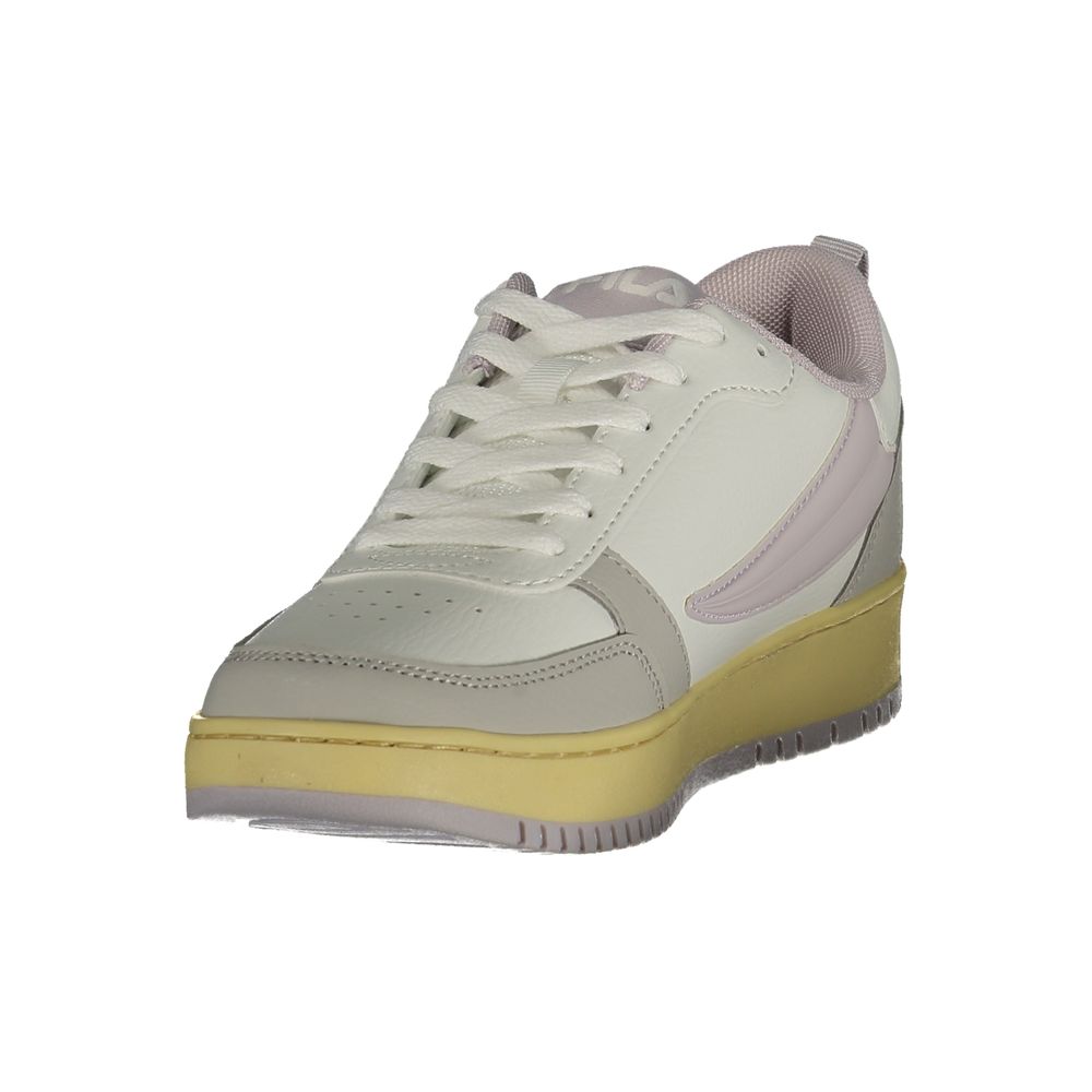 White and gray sneaker with a yellow sole on a white background