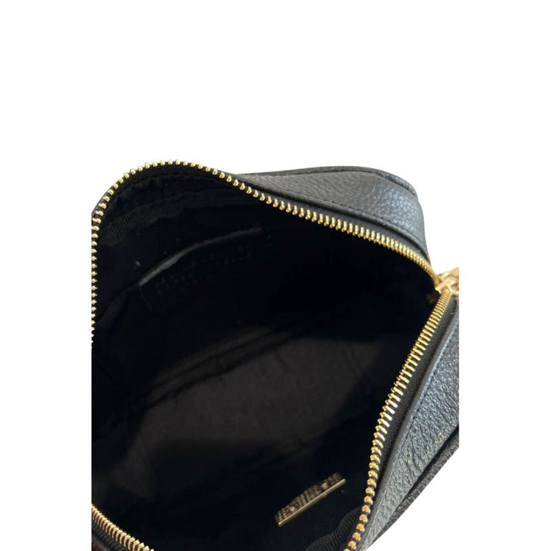 Black leather women's crossbody bag interior with gold zipper