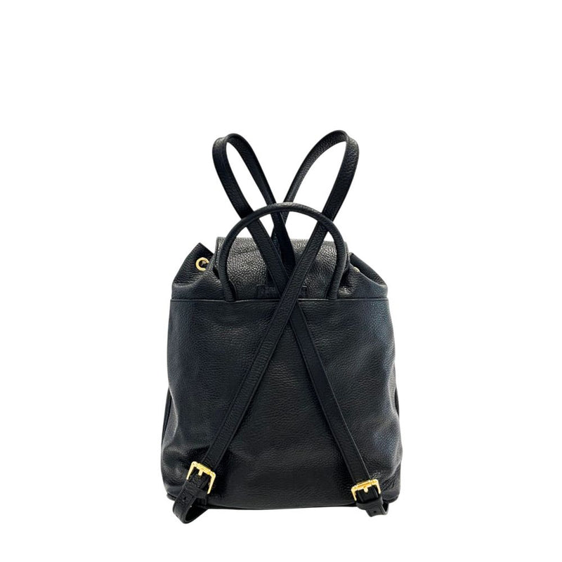 Black leather women backpack with crossed straps and gold hardware