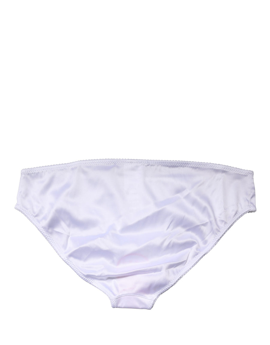 Close up of white silk stretch mid waist brief panty with scalloped trim