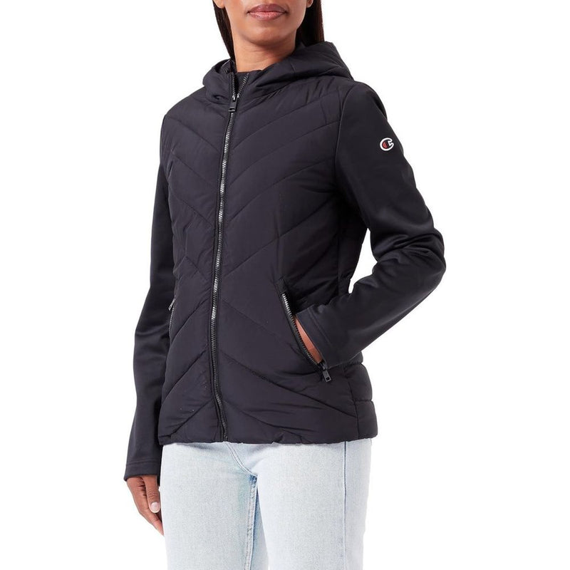 Black hooded polyester shell jacket with chevron quilting and zippered pockets worn by a person