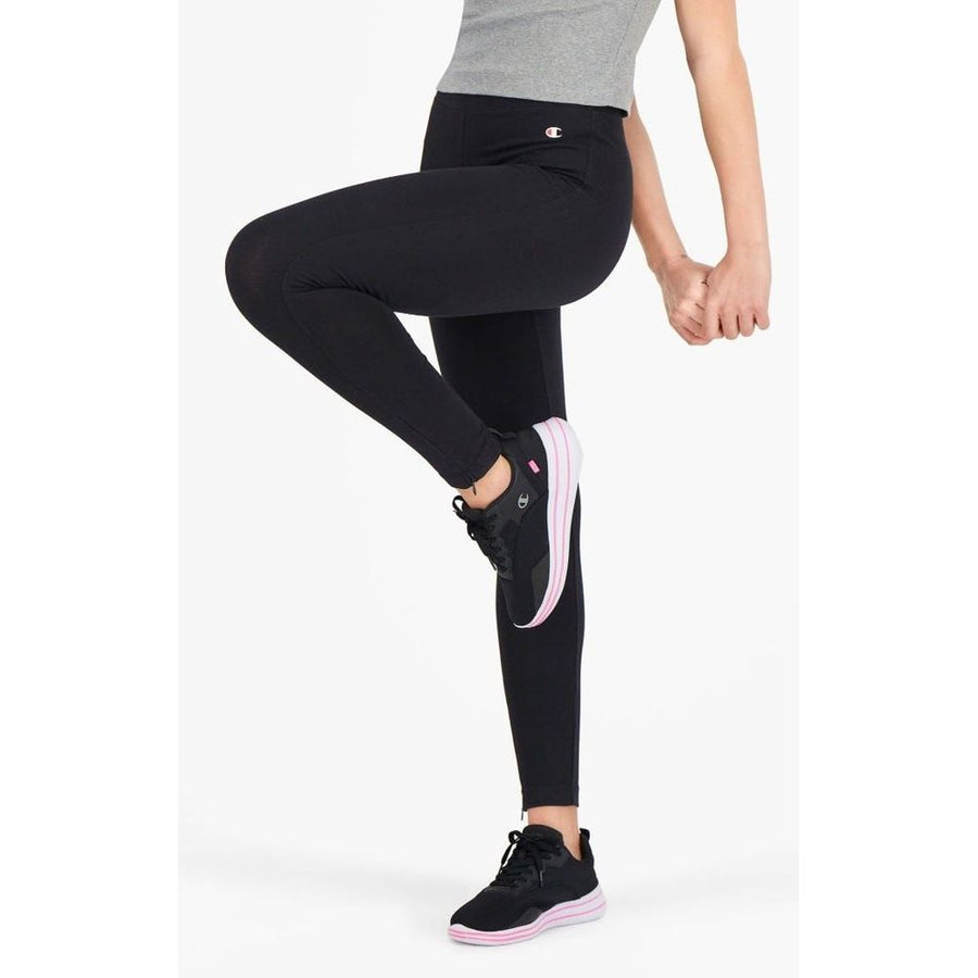 Black cotton ankle-length leggings worn by a woman kicking