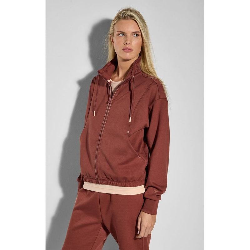 Burgundy polyester zip-up sweatshirt with a high collar and drawstrings worn by a woman