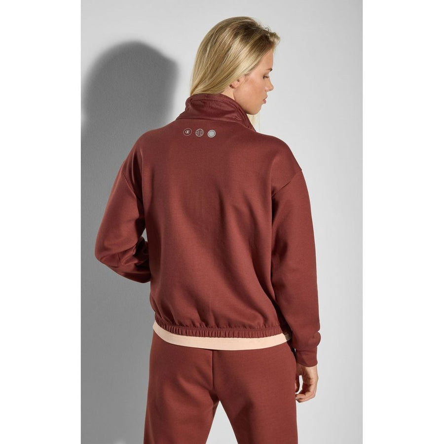 Burgundy polyester zip-up sweatshirt with a high collar and drawstrings worn by a woman