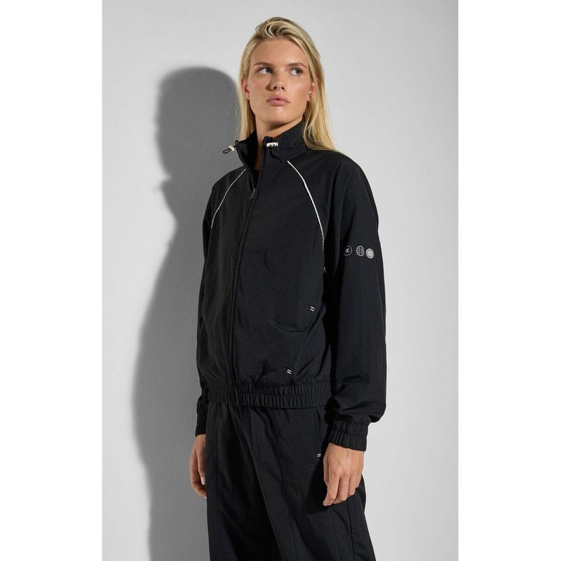 Black polyamide zip-up sweatshirt with a high neck and white piping worn by a model