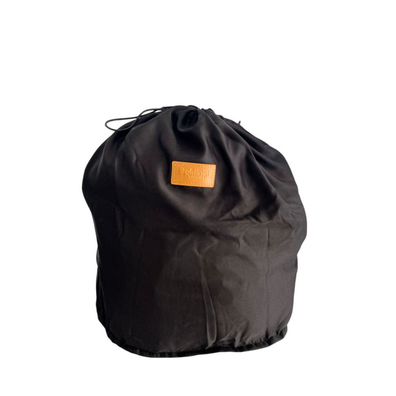 Black fabric dust bag with drawstring closure and a tan brand logo patch