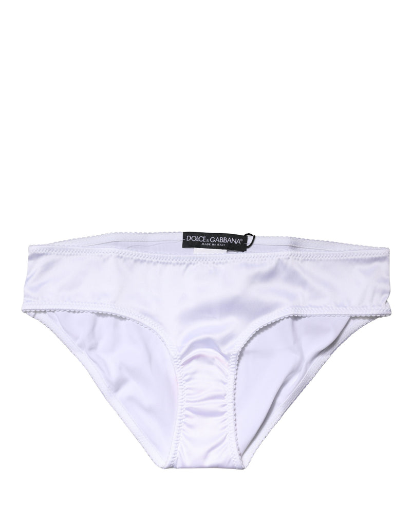 White stretch silk mid-waist brief panty with scalloped edges and black designer label on the waistband