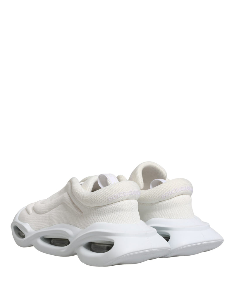 Dolce & Gabbana white mesh slip-on sneakers with chunky, sculptural rubber soles and embossed heel logo.