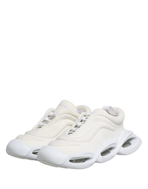 Dolce & Gabbana white slip-on low-top sneakers in textured mesh with a sculpted, oversized, cutout rubber sole.