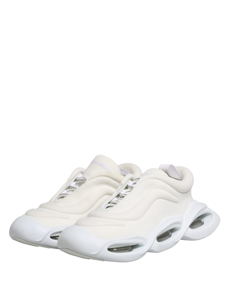 Dolce & Gabbana white slip-on low-top sneakers in textured mesh with a sculpted, oversized, cutout rubber sole.