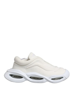 Dolce & Gabbana white mesh slip-on low-top sneakers with a futuristic, chunky cutout rubber sole.