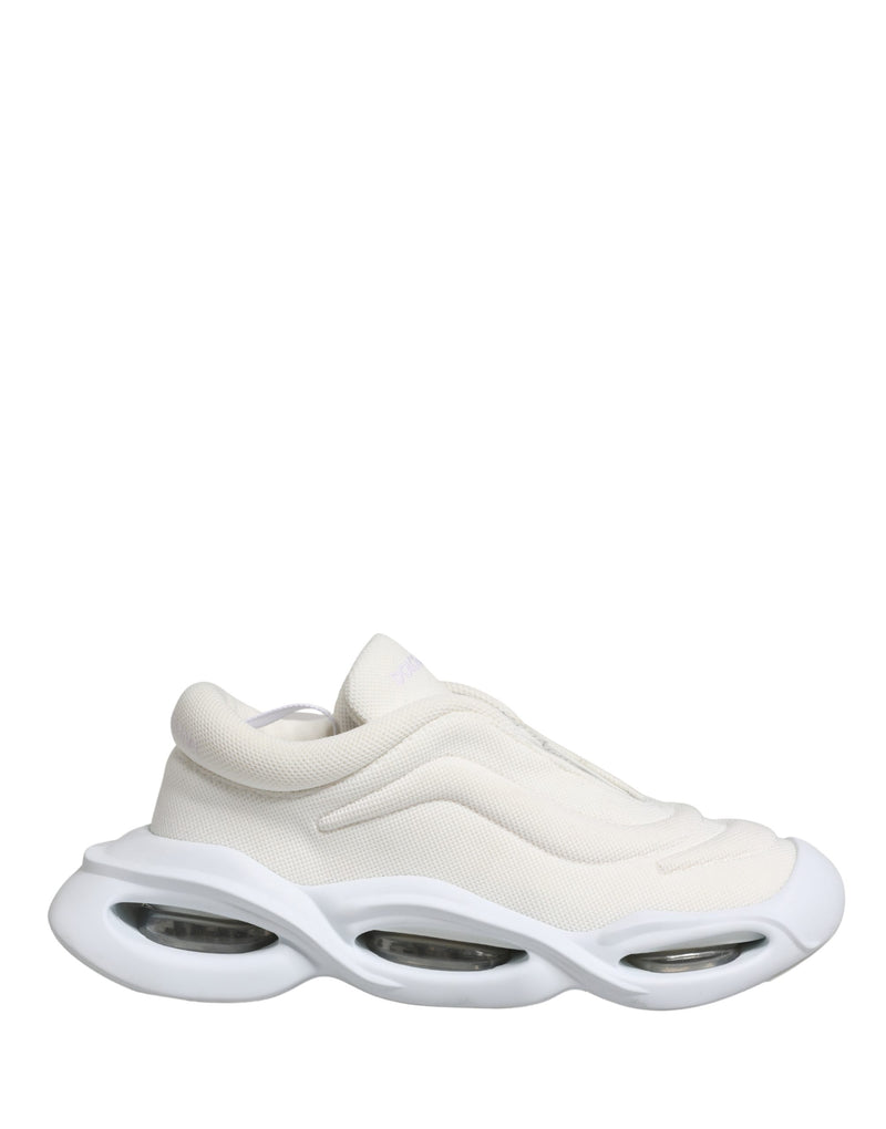 Dolce & Gabbana white mesh slip-on low-top sneakers with a futuristic, chunky cutout rubber sole.