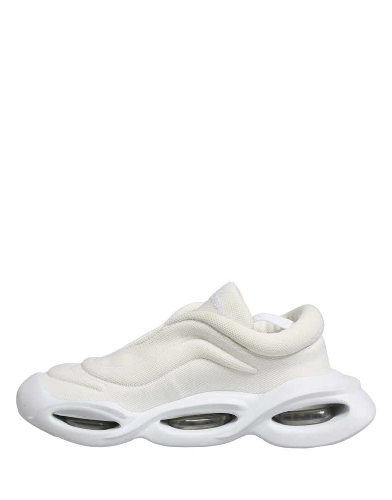 Dolce & Gabbana white mesh slip-on sneakers with a sculpted, wave-shaped thick rubber sole and transparent air pods.
