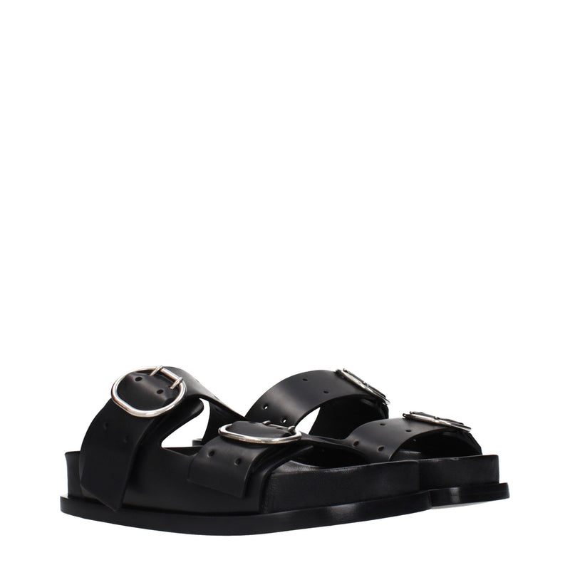 Black leather double-strap flat sandals with large silver buckles