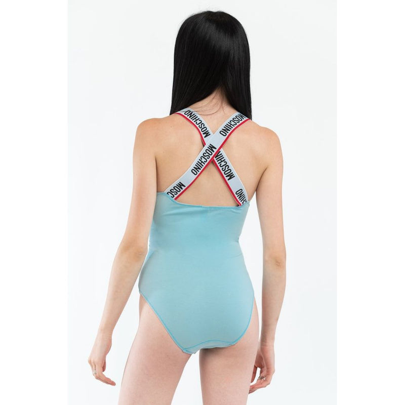 Light blue cotton bodysuit with crossed logo straps worn from behind