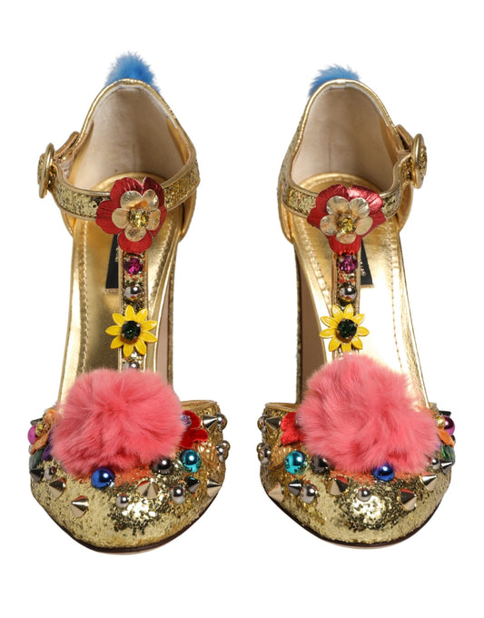 Dolce & Gabbana gold glitter T-strap heels with pink fur pom-poms, floral embellishments, and multi-colored studs.