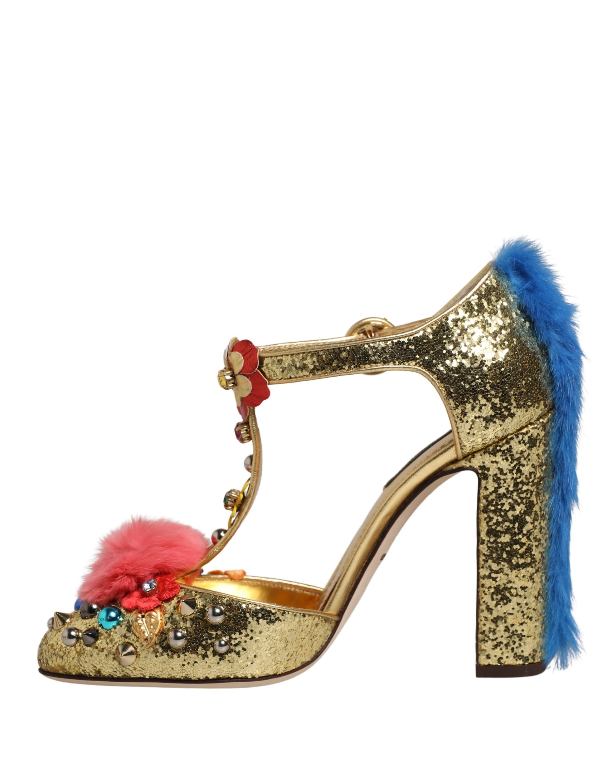 Dolce & Gabbana gold glitter T-strap heels with blue heel fur, pink pom-pom, floral accents, and colorful studs.
