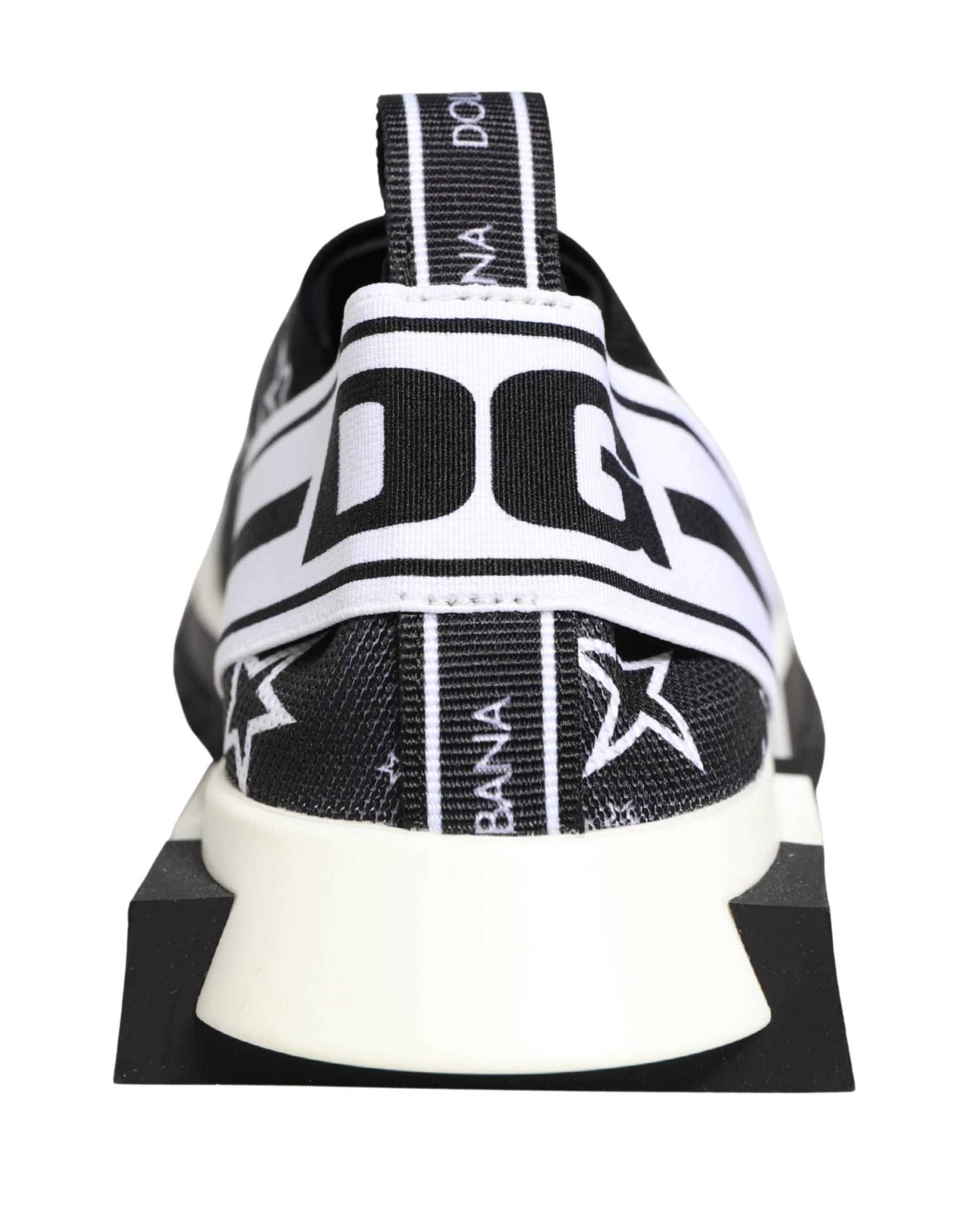 Black and white knit Dolce & Gabbana Sorrento sneaker with star print, DG logo heel strap, and chunky rubber sole.
