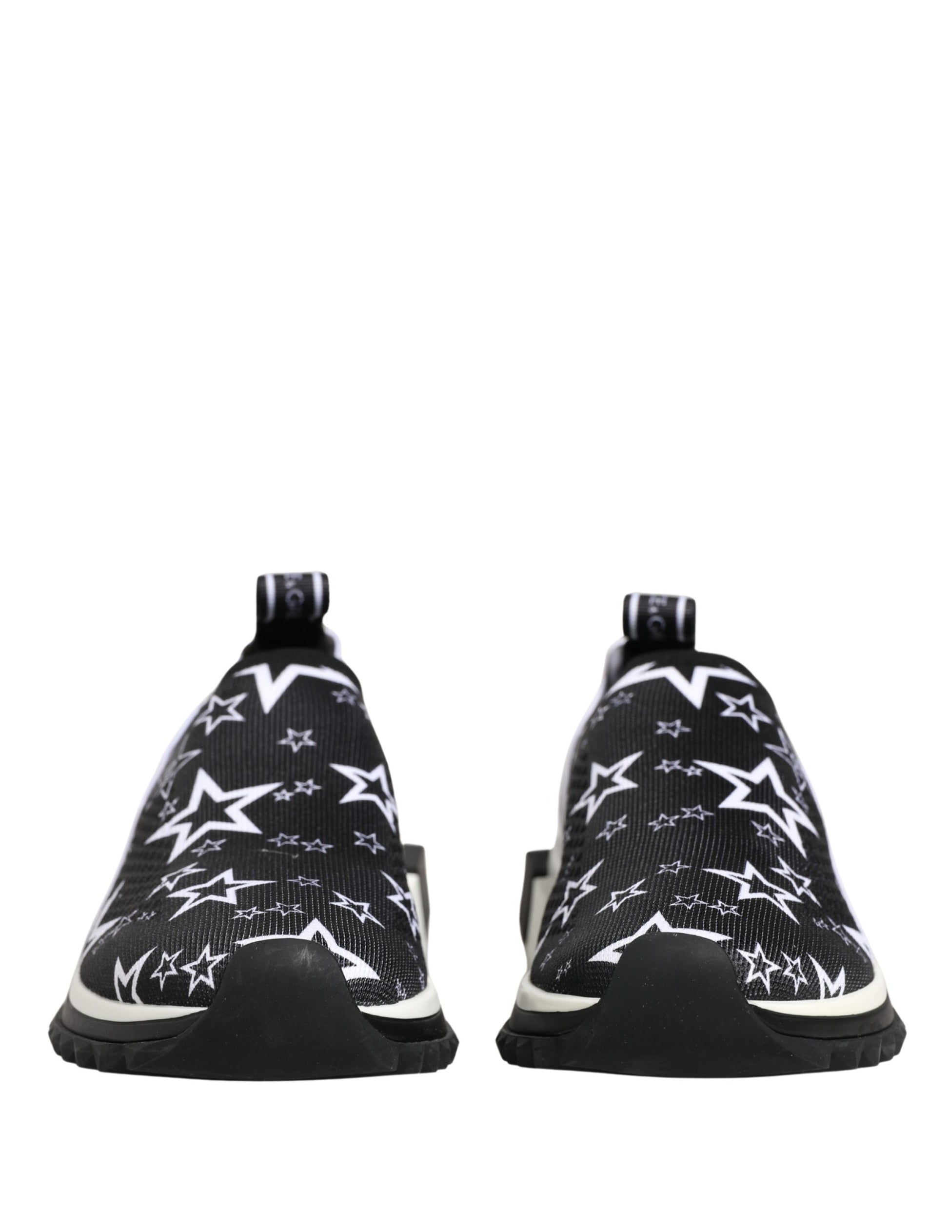 Dolce & Gabbana Sorrento slip-on sneakers in black stretch knit featuring a white star print and black rubber soles.