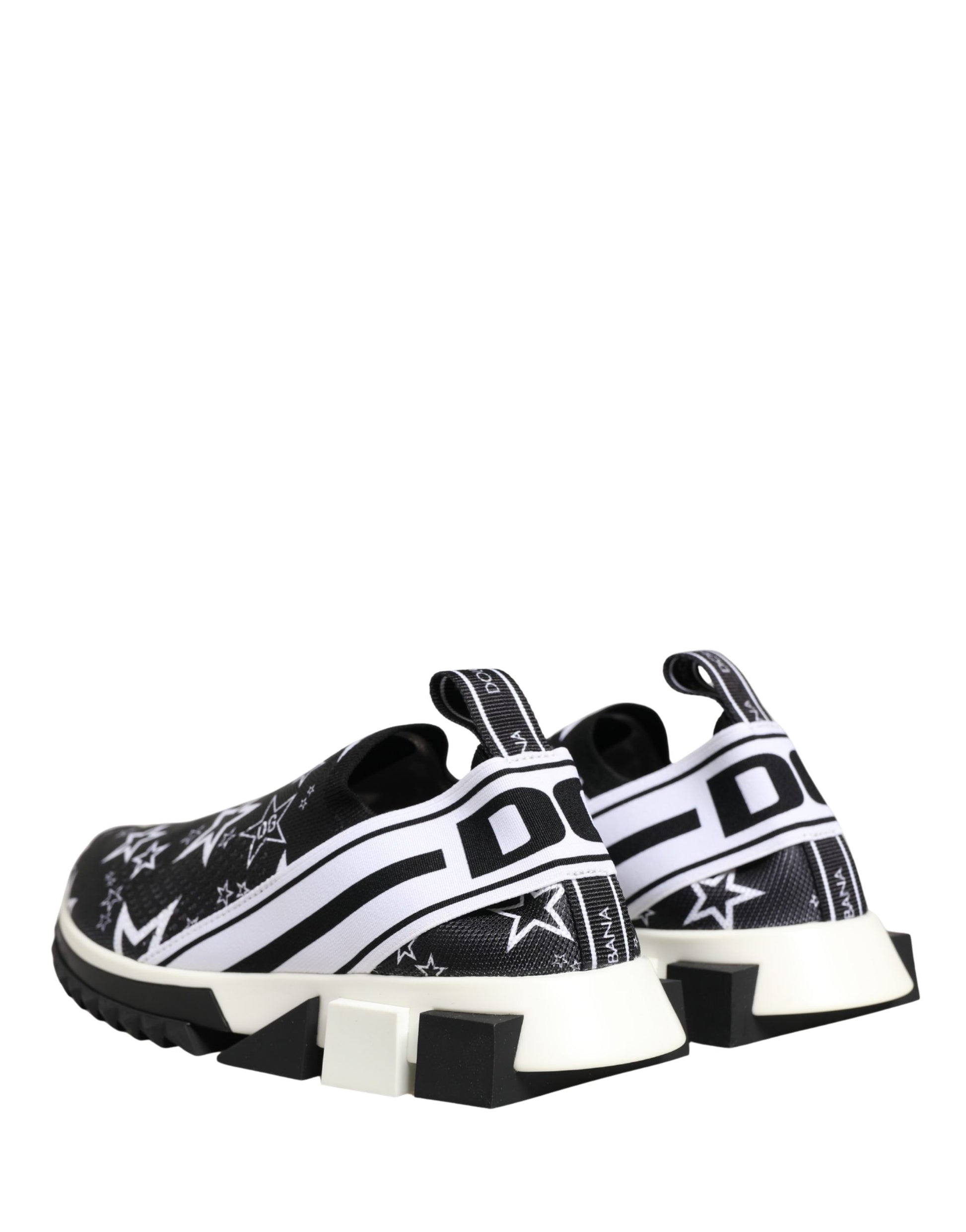 Black Dolce & Gabbana Sorrento sneakers in mesh with white star print, logo side straps, and thick white rubber soles.