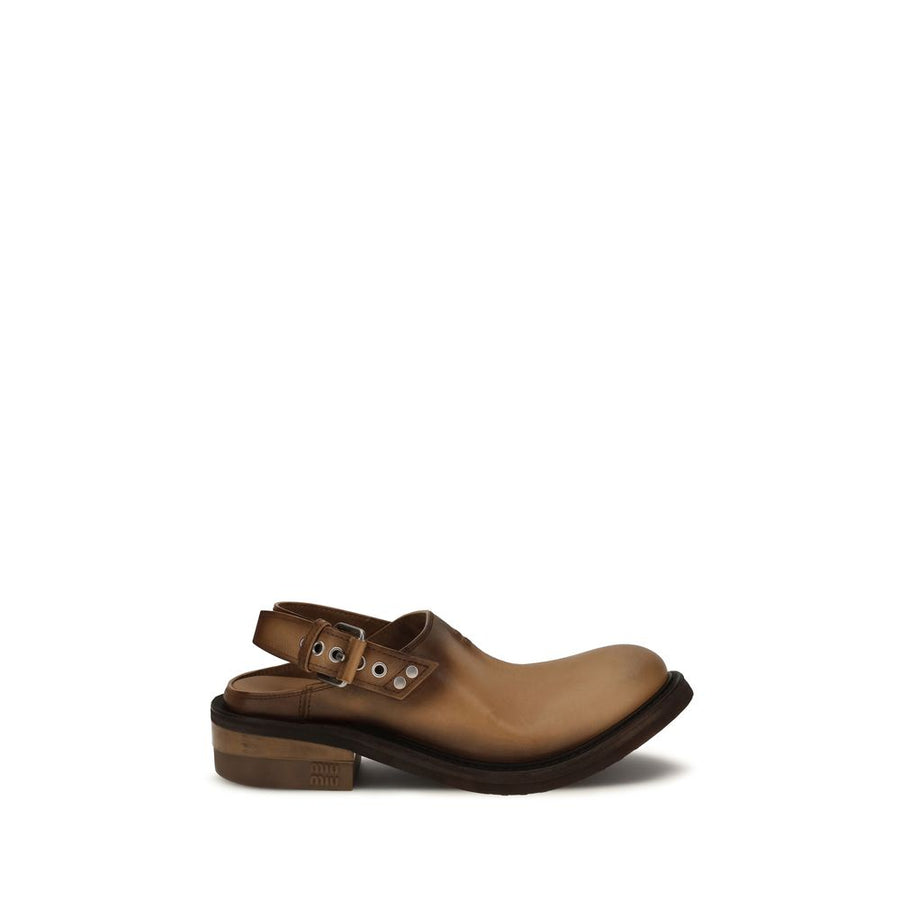 Miu Miu brown calf leather mules with a slingback buckled strap, round toe, and thick, chunky rubber sole.