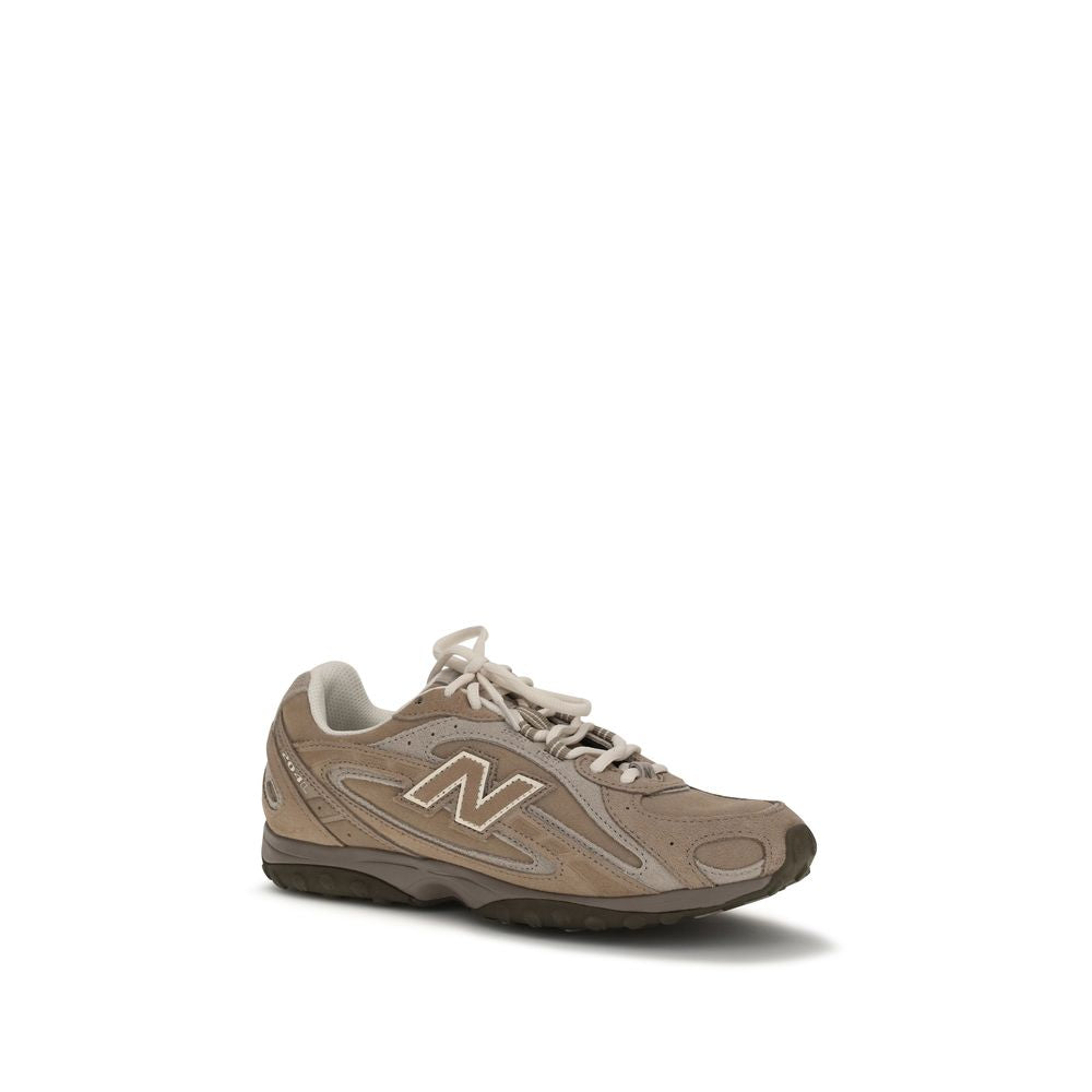 New Balance beige and taupe suede sneaker with lace-up closure and iconic N logo on the side.