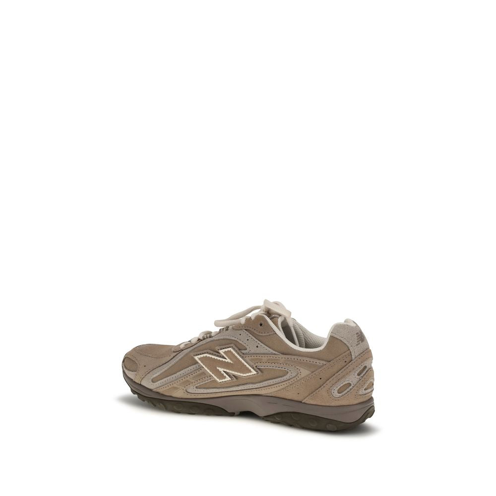 New Balance sneaker in light brown suede and mesh with an embroidered white N logo on the side and a dark brown sole.
