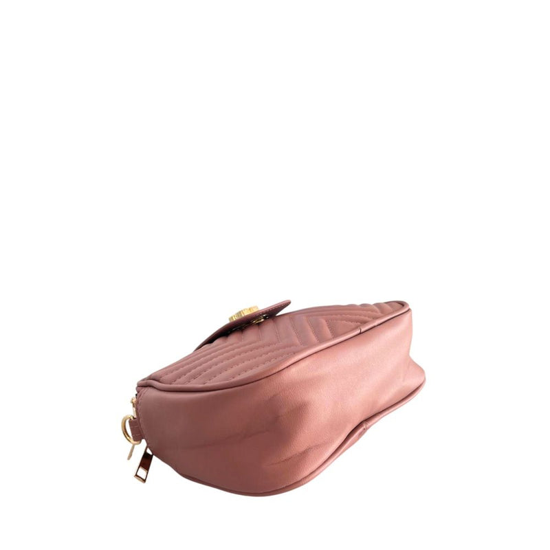 Pink PU leather quilted women's crossbody bag with a flap closure