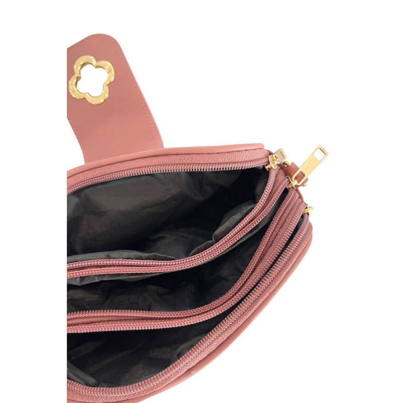 Open pink PU leather women's crossbody bag showing interior compartments