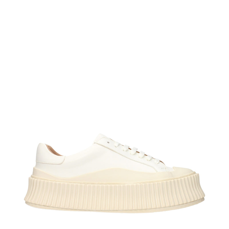 White leather platform sneakers with thick ridged soles