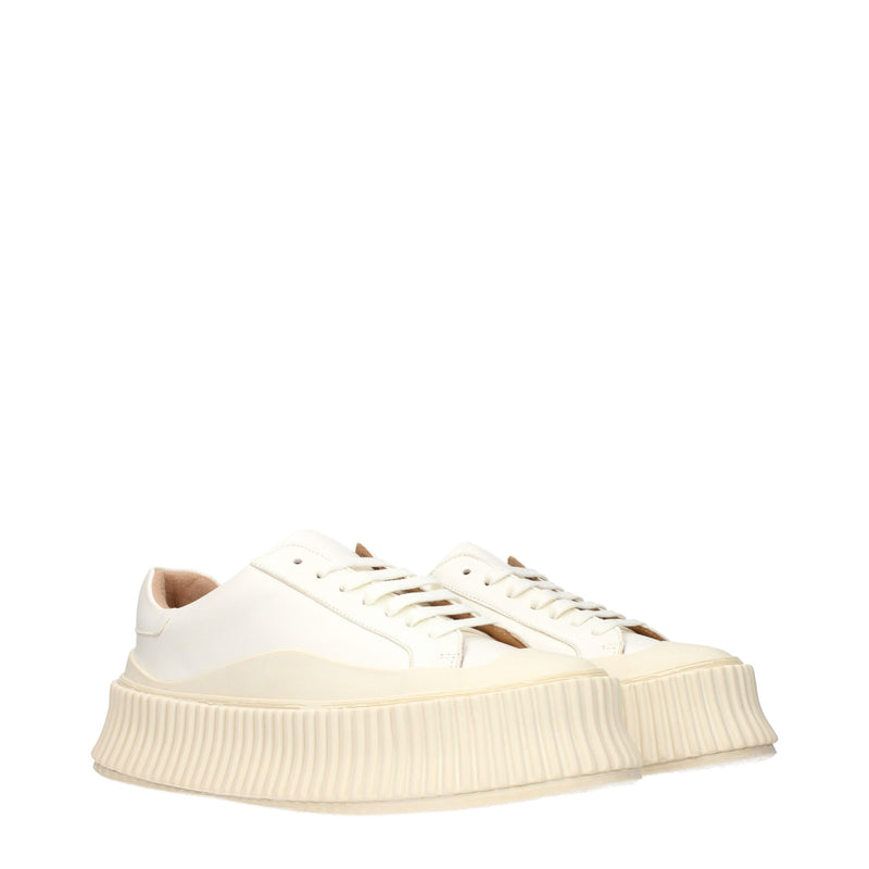 White leather platform sneakers with thick ribbed rubber soles