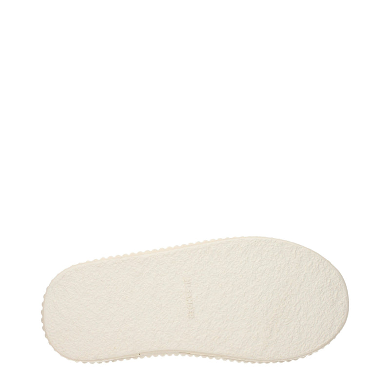 White textured rubber sneaker sole with a fluted edge and debossed logo