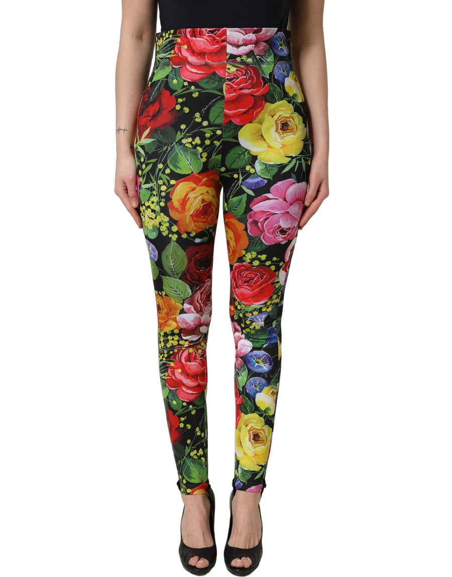 Multicolor floral stretch jersey fabric with vibrant pink, yellow, and green flowers on black