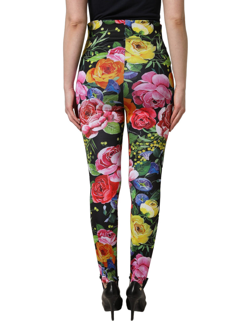 Dolce & Gabbana black stretch jersey leggings with vibrant multicolor floral print, viewed from behind