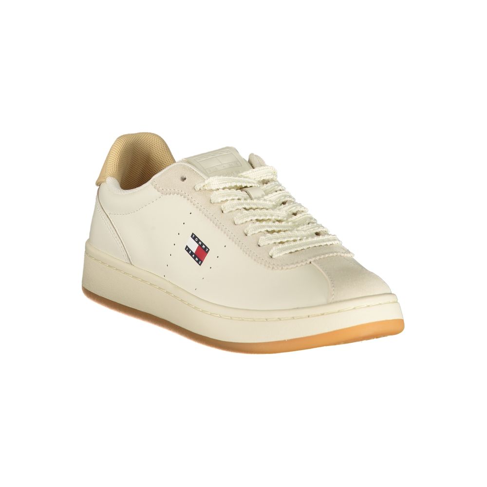 Tommy Hilfiger women's beige polyurethane lace-up sneakers with a gum sole and side logo detail.