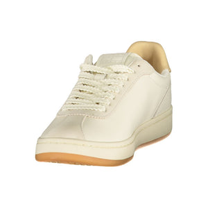 Tommy Hilfiger women's beige polyurethane lace-up sneakers with a gum sole, styled as a minimalist low-top trainer.