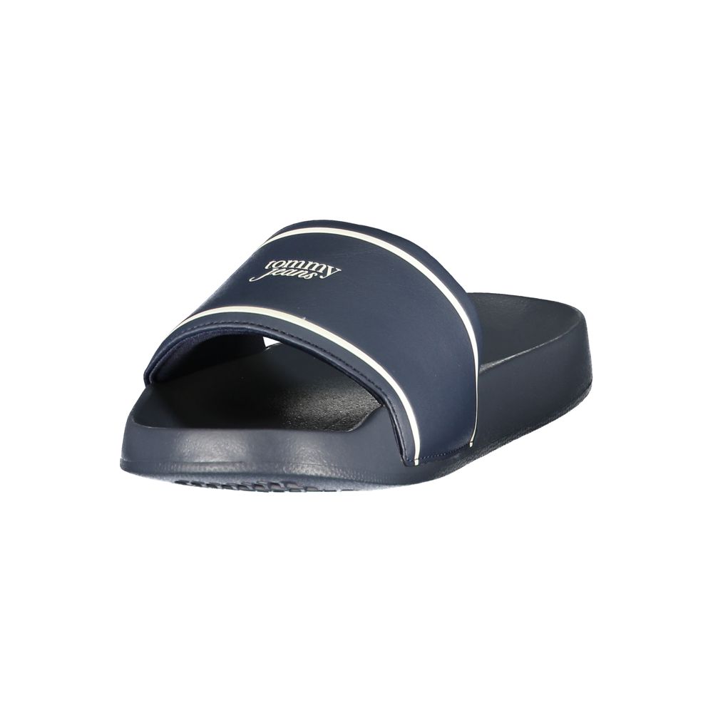 Tommy Hilfiger navy blue polyurethane slide sandal with white stripe and logo branding on the upper strap.