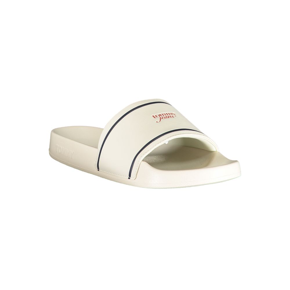 White Tommy Hilfiger polyurethane slide sandal with navy stripe and logo, featuring a molded footbed.