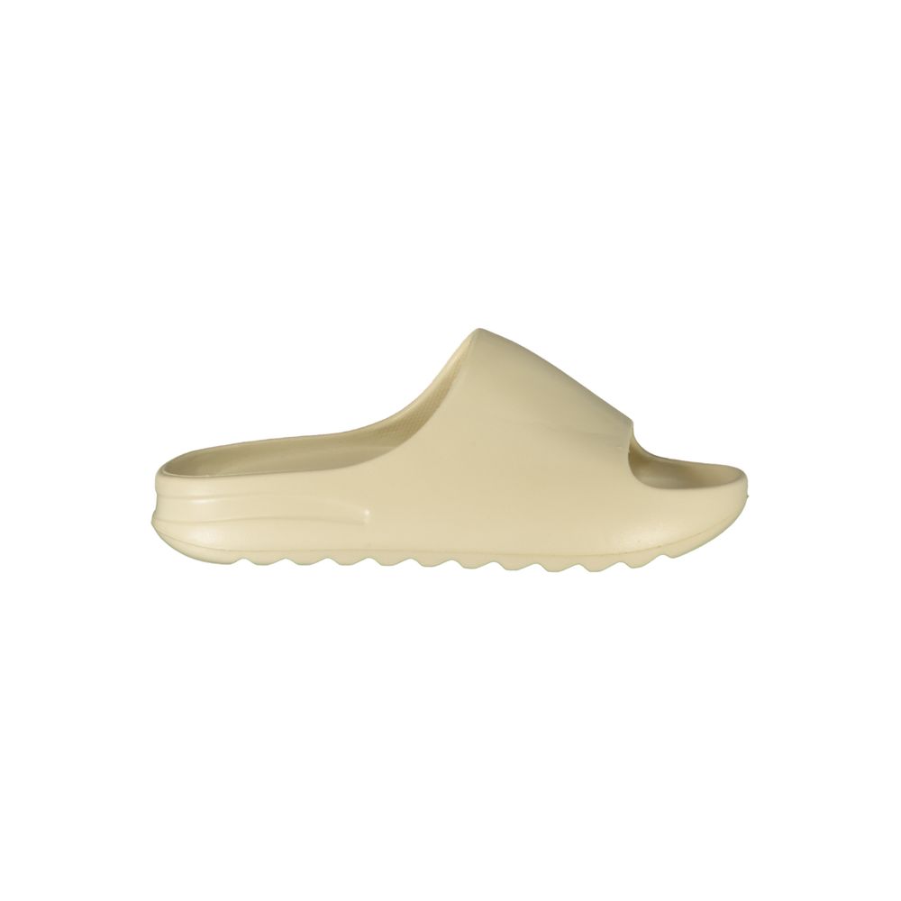 Beige polyurethane women's slide slipper in a simple, minimalist style, shown from the side.