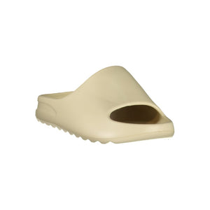 Beige polyurethane women's slide sandal with a minimalist design and textured sole.