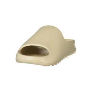 Beige polyurethane women's slide slipper with a minimalist, thick-soled design.