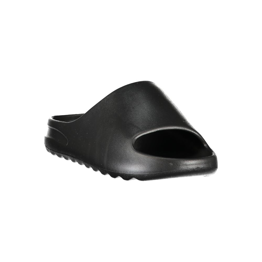 Black Norway 1963 women’s polyurethane slide-style slipper.