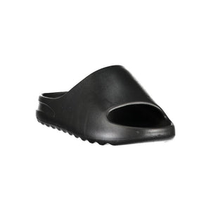 Black Norway 1963 women’s polyurethane slide-style slipper.