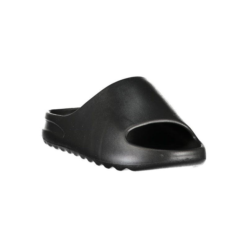 Black Norway 1963 women’s polyurethane slide-style slipper.