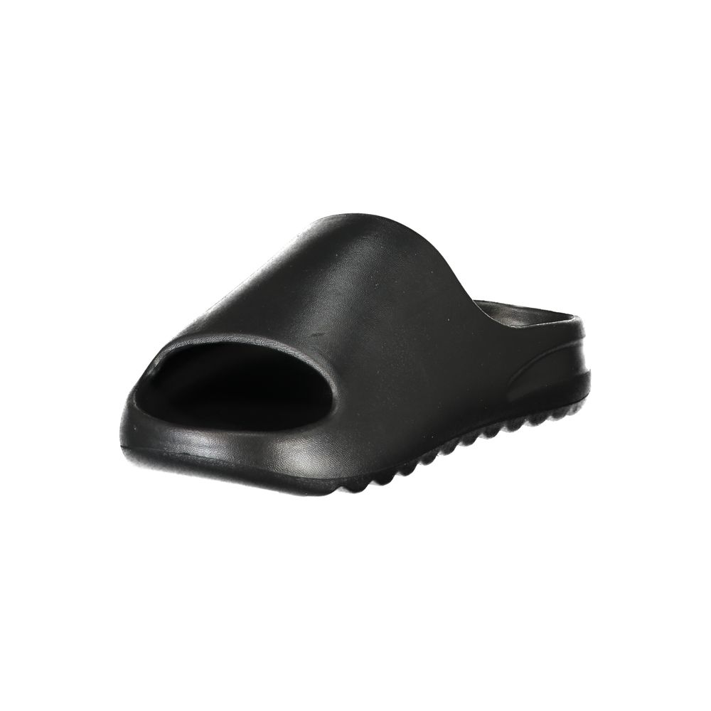 Black Norway 1963 women’s slide slipper made of smooth, minimalist polyurethane.