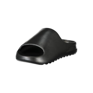 Black Norway 1963 women’s slide slipper made of smooth, minimalist polyurethane.