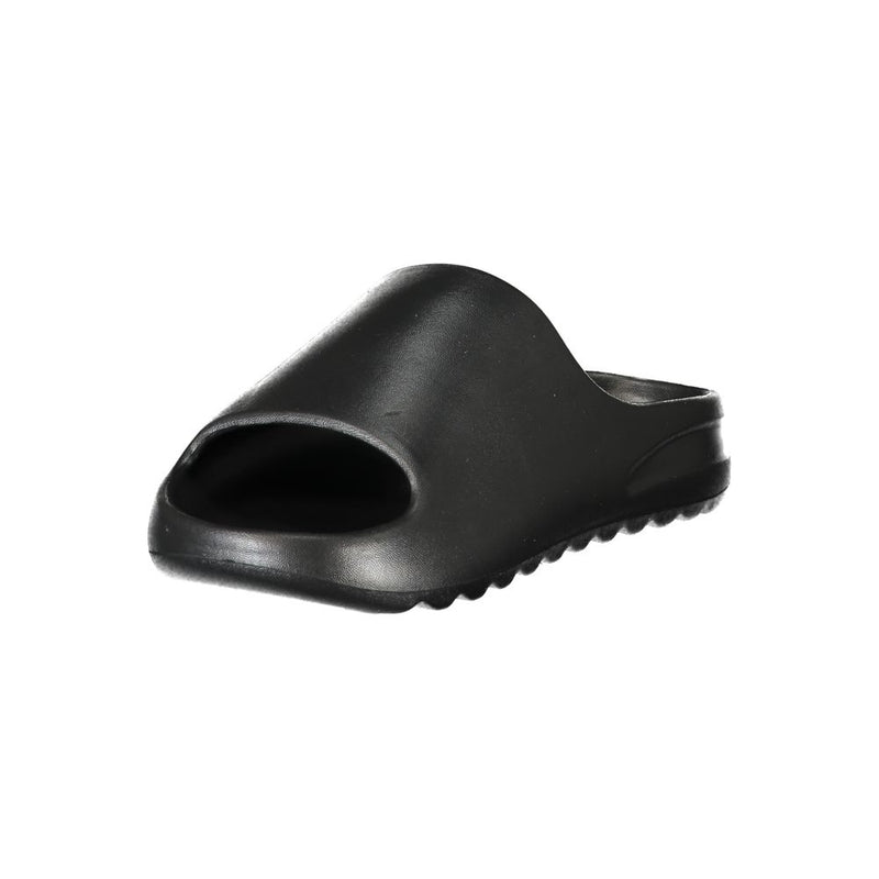Black Norway 1963 women’s slide slipper made of smooth, minimalist polyurethane.